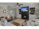 Open-concept living room with fireplace, staircase, and comfortable seating arrangement at 4019 Cascades Thrust, Summerville, SC 29483
