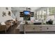 Comfortable living area with fireplace, stairs, hardwood flooring, and a well-lit atmosphere at 4019 Cascades Thrust, Summerville, SC 29483