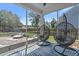 Cozy screened porch featuring comfortable seating and stylish hanging chairs, perfect for relaxation at 4019 Cascades Thrust, Summerville, SC 29483