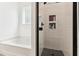 Bathroom features a soaking tub and a glass-enclosed shower with storage niches at 402 Bay Creek Dr, Charleston, SC 29414