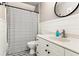 Bathroom features a vanity, toilet, shower with a white and black striped curtain at 402 Bay Creek Dr, Charleston, SC 29414