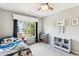 Well-lit bedroom with a bed, window, bookshelf, and decorations at 402 Bay Creek Dr, Charleston, SC 29414