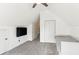 Cozy attic bedroom with sloped ceilings, comfortable daybed, and mounted tv at 402 Bay Creek Dr, Charleston, SC 29414