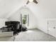 Attic bedroom featuring a pitched ceiling, comfortable workspace, and carpeted floor at 402 Bay Creek Dr, Charleston, SC 29414