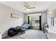 Bright bedroom with a ceiling fan, cozy armchair, and playful blue vehicle-themed bedding at 402 Bay Creek Dr, Charleston, SC 29414