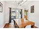 Bright dining area with a wooden table and access to the patio, offering an indoor-outdoor living experience at 402 Bay Creek Dr, Charleston, SC 29414