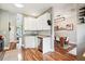 Bright kitchen with white cabinets and stainless steel appliances, connected to the dining room at 402 Bay Creek Dr, Charleston, SC 29414