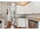 Cozy eat-in kitchen featuring stainless appliances, granite countertops, and a view of the front entrance at 402 Bay Creek Dr, Charleston, SC 29414