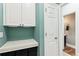 Laundry room with a countertop, cabinets, and access to a half bathroom at 402 Bay Creek Dr, Charleston, SC 29414