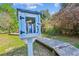 Charming little library box on a wooden pathway, surrounded by greenery at 402 Bay Creek Dr, Charleston, SC 29414