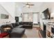 Cozy living room with vaulted ceilings, fireplace, and large sectional sofa at 402 Bay Creek Dr, Charleston, SC 29414