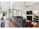 Cozy living room featuring a fireplace, television, and large sectional sofa at 402 Bay Creek Dr, Charleston, SC 29414