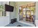 Inviting sunroom featuring modern furniture, tv, and a seamless indoor-outdoor transition at 402 Bay Creek Dr, Charleston, SC 29414
