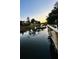 Tranquil water view at sunset, reflecting the surrounding trees and houses at 402 Bay Creek Dr, Charleston, SC 29414