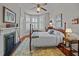 A traditional bedroom with a four-poster bed and decorative fireplace at 41 Legare St # C, Charleston, SC 29401