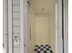 Interior of elevator with black and white checkered flooring and simple design at 41 Legare St # C, Charleston, SC 29401