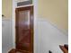 Inviting entryway featuring a wood door with adjustable blinds for privacy and natural light control at 41 Legare St # C, Charleston, SC 29401
