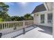 Bright balcony features a white railing and french doors, perfect for enjoying the outdoors at 413 Station 22 1/2 St, Sullivans Island, SC 29482