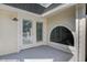 Balcony with french doors boasts an arched window, allowing for natural light and architectural charm at 413 Station 22 1/2 St, Sullivans Island, SC 29482