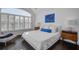 Bright bedroom with arched windows, hardwood floors and stylish decor at 413 Station 22 1/2 St, Sullivans Island, SC 29482