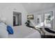 Bright bedroom with a TV, hardwood floors and access to a patio at 413 Station 22 1/2 St, Sullivans Island, SC 29482