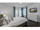 Main bedroom with white walls, wood floors, and patio access at 413 Station 22 1/2 St, Sullivans Island, SC 29482