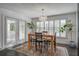 Bright dining room with natural light and a stylish light fixture, and french doors at 413 Station 22 1/2 St, Sullivans Island, SC 29482
