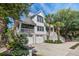Beautiful two-story home with a covered porch and well-maintained landscaping, creating curb appeal at 413 Station 22 1/2 St, Sullivans Island, SC 29482