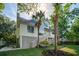 Beautiful beach house with a staircase and hammock surrounded by palm trees at 413 Station 22 1/2 St, Sullivans Island, SC 29482