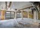 Spacious garage with multiple bay doors and ample room for storage and vehicles at 413 Station 22 1/2 St, Sullivans Island, SC 29482