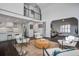 Open-concept living space with lots of light and modern decor, connecting the kitchen and living areas at 413 Station 22 1/2 St, Sullivans Island, SC 29482