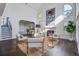 Bright living room with high ceilings, fireplace, stylish decor, and an abundance of natural light at 413 Station 22 1/2 St, Sullivans Island, SC 29482