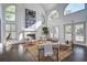 Bright living room with high ceilings, fireplace, stylish decor, and an abundance of natural light at 413 Station 22 1/2 St, Sullivans Island, SC 29482