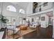 Bright living room with large windows, fireplace, and modern furnishings at 413 Station 22 1/2 St, Sullivans Island, SC 29482