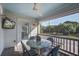 Outdoor patio featuring a marble table, outdoor seating, and a ceiling fan at 413 Station 22 1/2 St, Sullivans Island, SC 29482