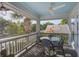 Covered patio with a ceiling fan, outdoor seating, and neighborhood views at 413 Station 22 1/2 St, Sullivans Island, SC 29482