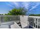 Rooftop patio with stairs and escape hatch that leads to lower levels at 413 Station 22 1/2 St, Sullivans Island, SC 29482