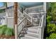 Inviting staircase leading to a charming porch at 413 Station 22 1/2 St, Sullivans Island, SC 29482