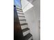 Unique staircase with dark wood treads and white risers leads to upper level at 413 Station 22 1/2 St, Sullivans Island, SC 29482