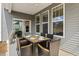 Back porch with dining table overlooks spacious backyard, perfect for outdoor gatherings at 4314 Grange Cir, Summerville, SC 29486