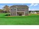 Backyard featuring a covered patio and a large lawn, perfect for outdoor enjoyment at 4314 Grange Cir, Summerville, SC 29486