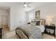 Comfortable bedroom offers two windows, light hardwood floors, a spacious closet and soft, neutral decor at 4314 Grange Cir, Summerville, SC 29486