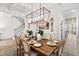 Elegant dining room features modern chandelier, stylish decor, and plenty of natural light at 4314 Grange Cir, Summerville, SC 29486