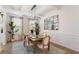 Elegant dining room features modern chandelier, stylish decor, and plenty of natural light at 4314 Grange Cir, Summerville, SC 29486