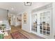 Welcoming entryway features wood floors, a staircase, and a view of the home office at 4314 Grange Cir, Summerville, SC 29486