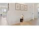 Hallway boasts a dog nook, hardwood floors, and modern decor at 4314 Grange Cir, Summerville, SC 29486