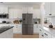 Modern kitchen features white cabinetry, stainless steel appliances, and granite countertops at 4314 Grange Cir, Summerville, SC 29486