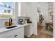 Bright kitchen features white cabinetry, stainless steel appliances, and modern fixtures at 4314 Grange Cir, Summerville, SC 29486