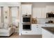Modern white kitchen features stainless steel appliances and an open-concept design at 4314 Grange Cir, Summerville, SC 29486