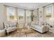 Bright living room featuring a comfortable seating area, large windows, and stylish decor at 4314 Grange Cir, Summerville, SC 29486